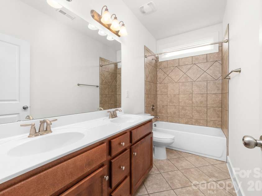 612 Academy Street, McAdenville, NC 28101.  MLS# CAR4376795, YatesRealty ID 19349. Interior Second Level Full bathroom