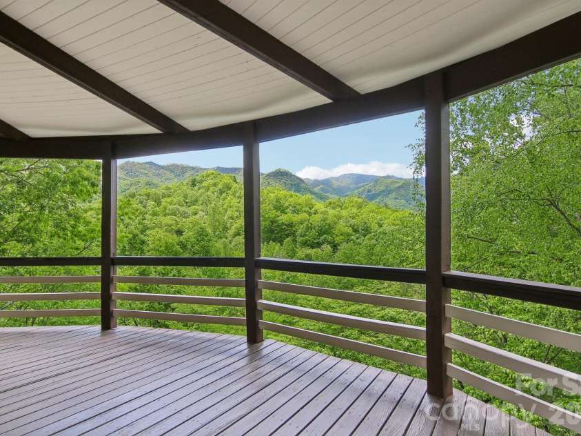 295 Dills Road, Bryson City, NC 28713.  MLS# CAR4373473, YatesRealty ID 19361. Covered decks are a plenty for guests and relaxation