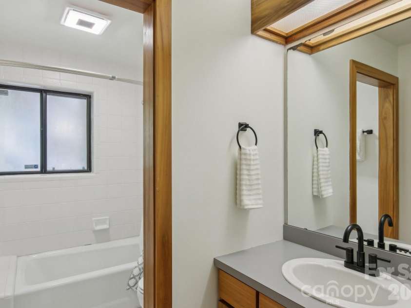 295 Dills Road, Bryson City, NC 28713.  MLS# CAR4373473, YatesRealty ID 19361. Primary suite bathroom