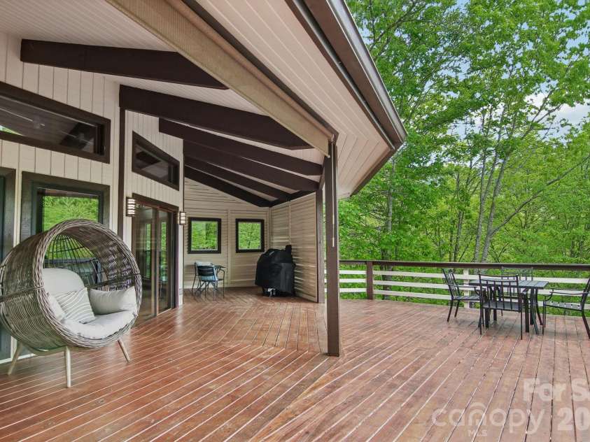295 Dills Road, Bryson City, NC 28713.  MLS# CAR4373473, YatesRealty ID 19361. Spacious deck, covered and uncovered, off of the main level.