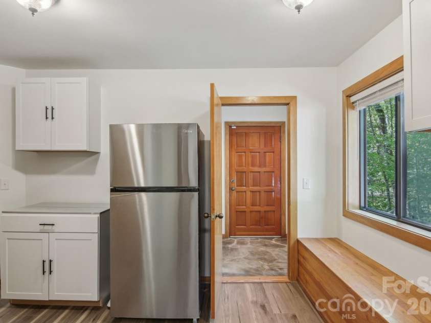 295 Dills Road, Bryson City, NC 28713.  MLS# CAR4373473, YatesRealty ID 19361. The butlers pantry and mud room