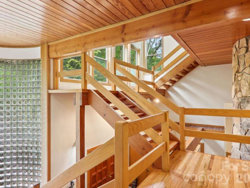 295 Dills Road, Bryson City, NC 28713.  MLS# CAR4373473, YatesRealty ID 19361. The design and architecture shown in the steps up and down in this home