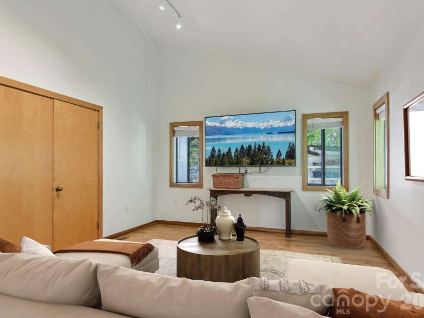 295 Dills Road, Bryson City, NC 28713.  MLS# CAR4373473, YatesRealty ID 19361. The virtually staged media room on main living floor