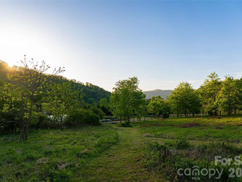10 and 12 Dogwood Hills Lane, Weaverville, NC 28787.  MLS# CAR4374354, YatesRealty ID 19362. Flat, cleared pasture is ideal for gardens or hobby farm