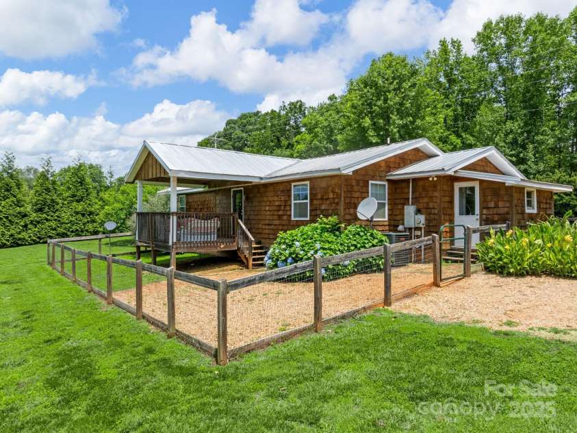 2784 Pea Ridge Road, Mill Spring, NC 28756.  MLS# CAR4271067, YatesRealty ID 19366. Fenced backyard
