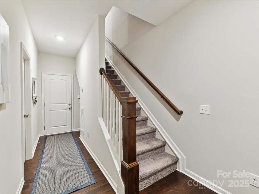 1132 Whitby Moore Street, Charlotte, NC 28273.  MLS# CAR4268789, YatesRealty ID 19378. Lower Level hallway with access to garage