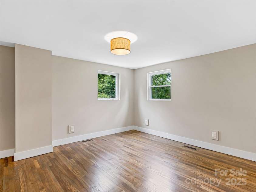 162 Courtland Place, Asheville, NC 28801.  MLS# CAR4261167, YatesRealty ID 19387. Lower Level Bedroom
