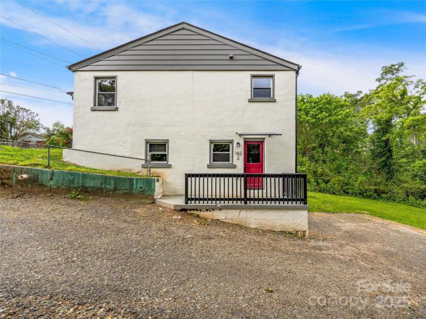 162 Courtland Place, Asheville, NC 28801.  MLS# CAR4261167, YatesRealty ID 19387. Lower level unit entrance