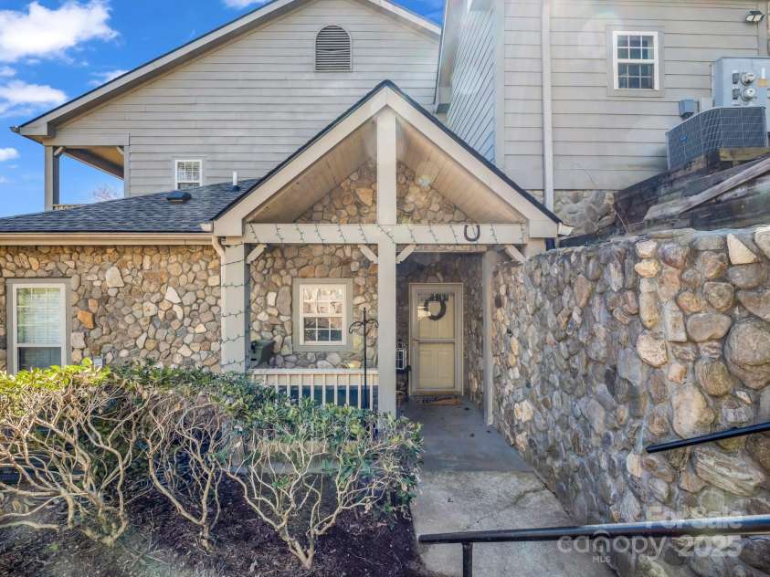 158 Stonecrest Court, Lake Lure, NC 28746.  MLS# CAR4230404, YatesRealty ID 19391. Steps down to entry