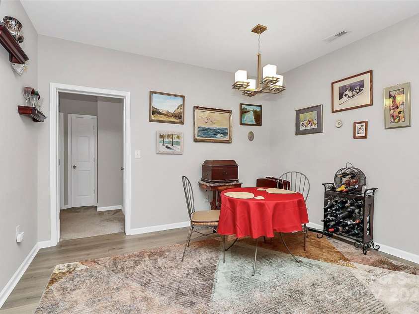 14451 San Paolo Lane, Charlotte, NC 28277.  MLS# CAR4270564, YatesRealty ID 19401. Updated LVP flooring throughout living areas and Primary Bedroom