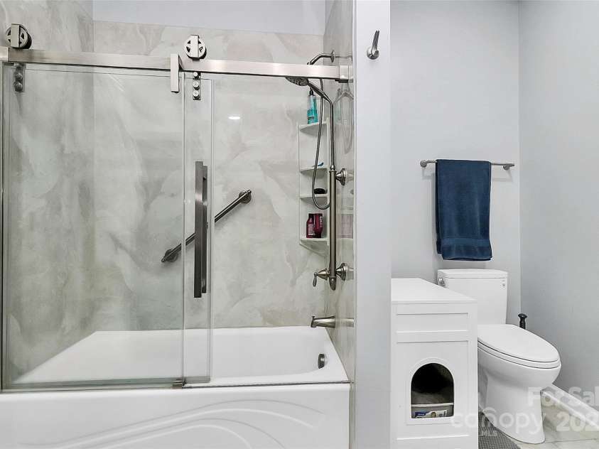 14451 San Paolo Lane, Charlotte, NC 28277.  MLS# CAR4270564, YatesRealty ID 19401. Updated Primary Shower with glass doors and grab bar
