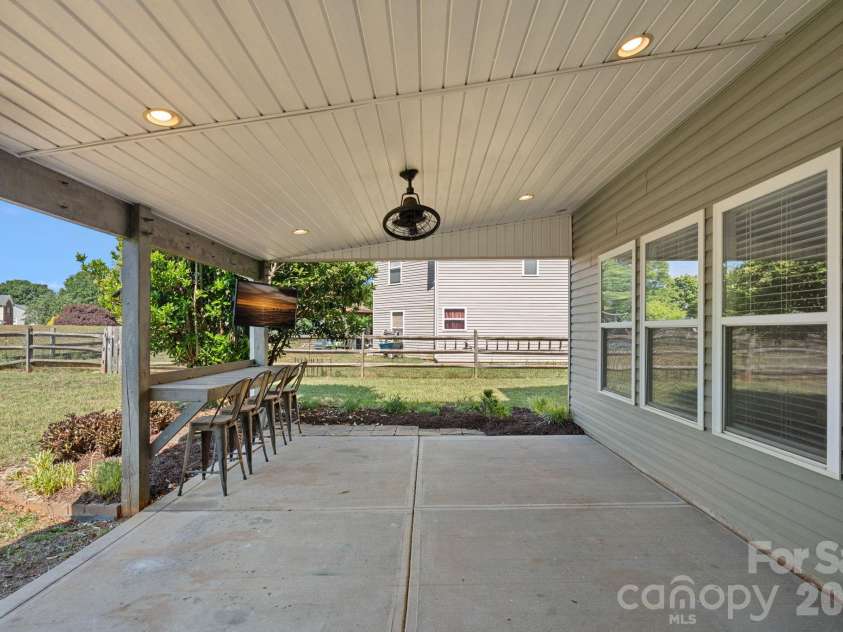 1918 Leesburg Drive, Clover, SC 29710.  MLS# CAR4376796, YatesRealty ID 19409. Large covered back patio