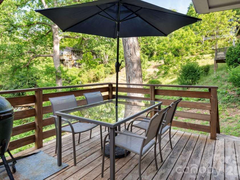 126 Maney Avenue, Asheville, NC 28804.  MLS# CAR4377780, YatesRealty ID 19416. Rear deck with steps leading to backyard