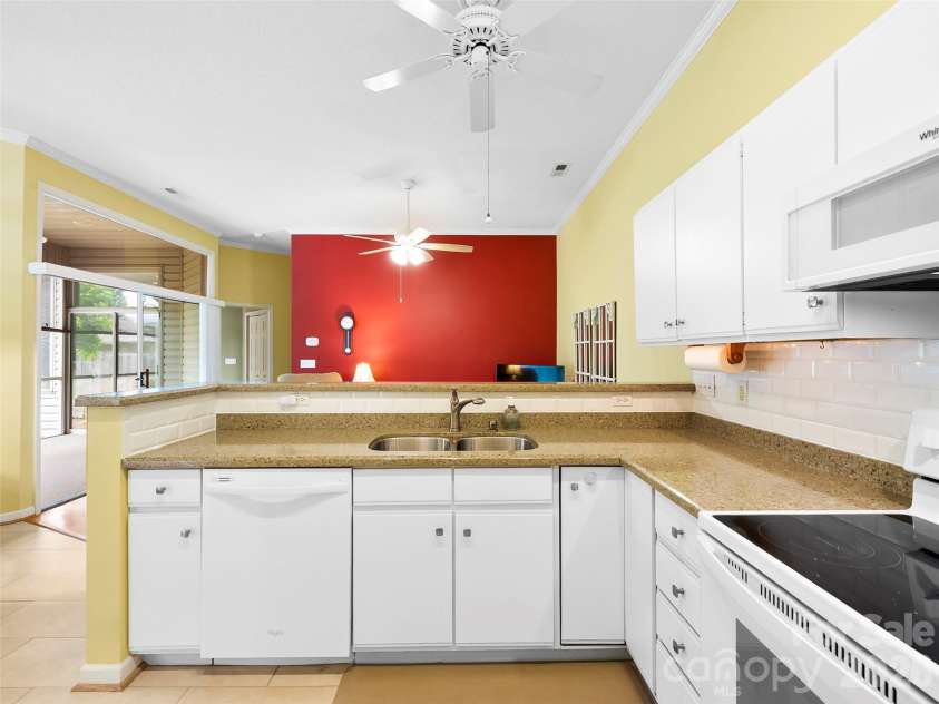 29 Tisha Lane, Hendersonville, NC 28739.  MLS# CAR4378450, YatesRealty ID 19429. Kitchen looking into Den