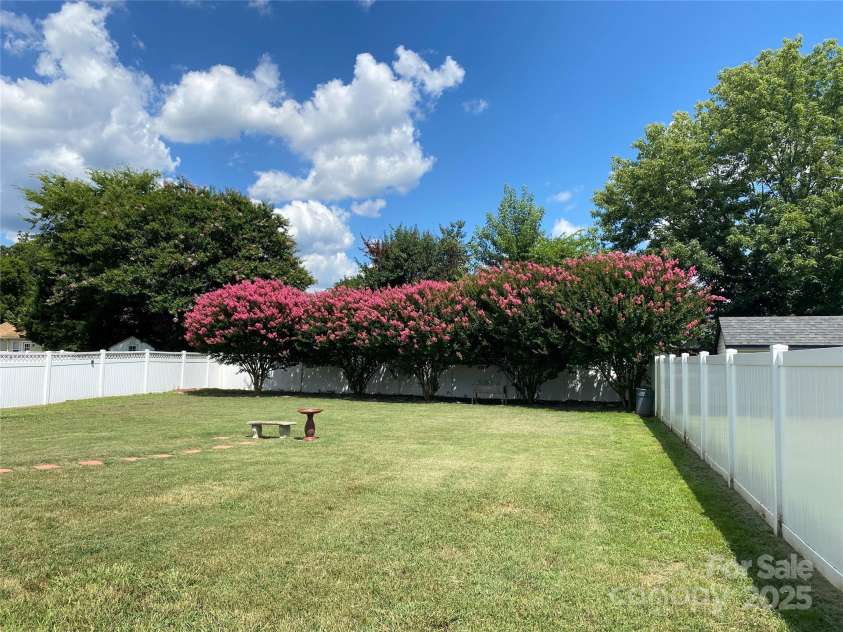 4562 Lanstone Court, Concord, NC 28027.  MLS# CAR4328877, YatesRealty ID 19431. Beautiful Backyard in Summer