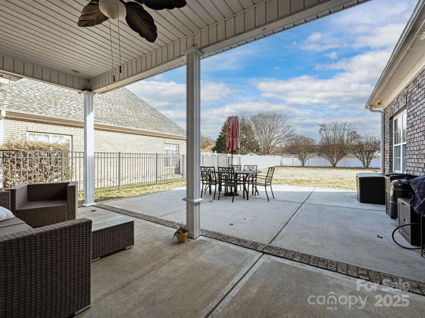 4562 Lanstone Court, Concord, NC 28027.  MLS# CAR4328877, YatesRealty ID 19431. Breakfast Area Opens to Covered Porch & View Out Back