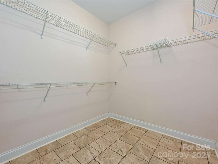 4562 Lanstone Court, Concord, NC 28027.  MLS# CAR4328877, YatesRealty ID 19431. One of Two Primary Suite Walk-in Closets 