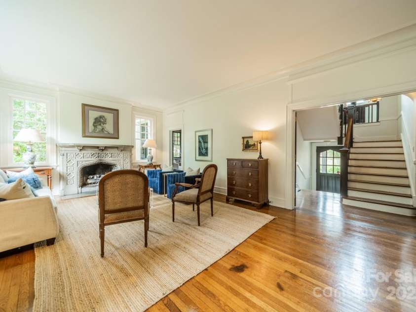 1919 Kensal Court, Charlotte, NC 28211.  MLS# CAR4193792, YatesRealty ID 19433. As you enter the home through the front door, you are greeted with tall ceilings, hard wood floors and incredible molding details in the Formal Living Room.  The stairs lead up to the Primary Suite as well as 4 additiona