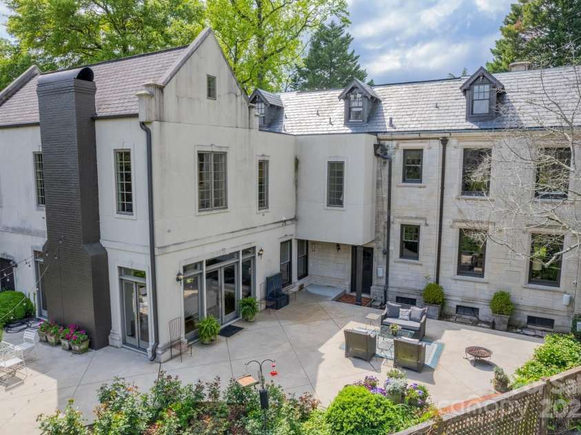 1919 Kensal Court, Charlotte, NC 28211.  MLS# CAR4193792, YatesRealty ID 19433. View of the back terrace area and the back of the home.