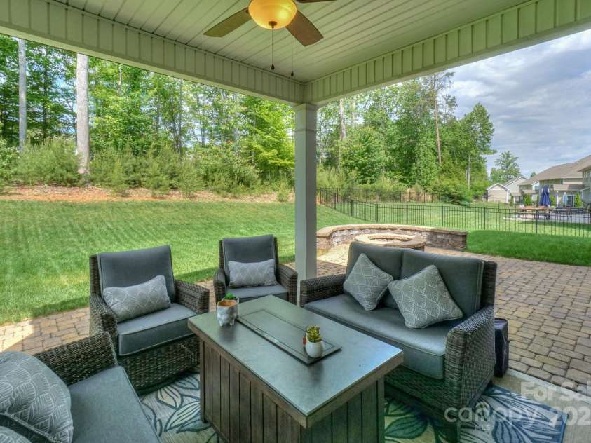 135 Canoe Pole Lane, Mooresville, NC 28117.  MLS# CAR4254258, YatesRealty ID 19439. Covered Patio; Pavers and Firepit