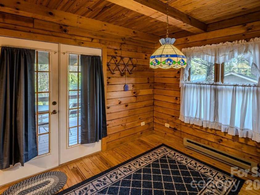 86 Hickory Lane, Newland, NC 28657.  MLS# CAR4378825, YatesRealty ID 19439. Dining area opens to spacious covered deck