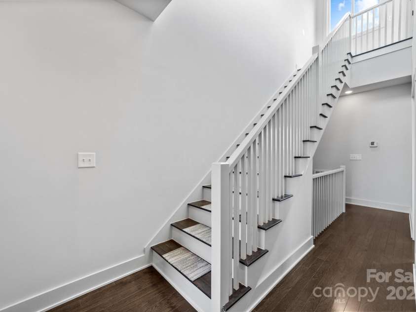 919 Cityscape Drive, Charlotte, NC 28205.  MLS# CAR4263066, YatesRealty ID 19441. Upper level hallway and stairs up to rooftop