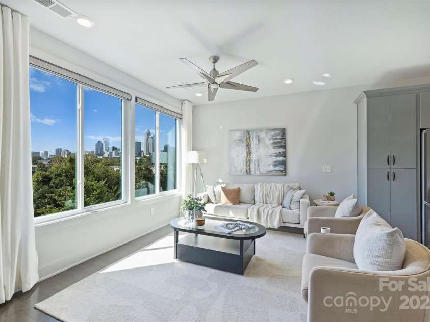 919 Cityscape Drive, Charlotte, NC 28205.  MLS# CAR4313409, YatesRealty ID 19441. Living room with city views!