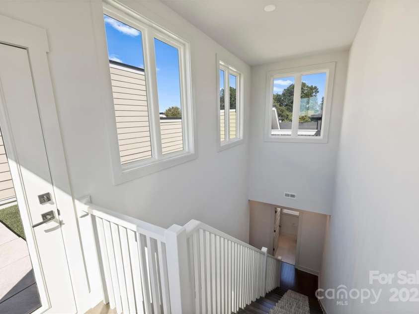 919 Cityscape Drive, Charlotte, NC 28205.  MLS# CAR4313409, YatesRealty ID 19441. Stairwell to rooftop terrace