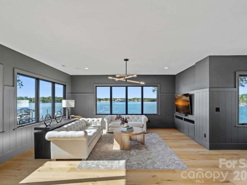 17811 Largo Place, Cornelius, NC 28031.  MLS# CAR4428601, YatesRealty ID 1945. Expansive upper-level bonus room wrapped in panoramic lake views, offering generous space for lounging, games and entertaining.
