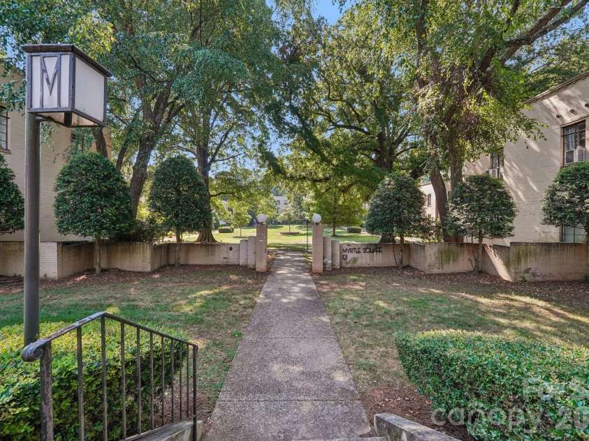 1121 Myrtle Avenue, Charlotte, NC 28203.  MLS# CAR4421930, YatesRealty ID 19454. Mature trees and community sidewalks