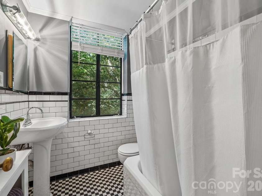 1121 Myrtle Avenue, Charlotte, NC 28203.  MLS# CAR4421930, YatesRealty ID 19454. Original floor tile in bath