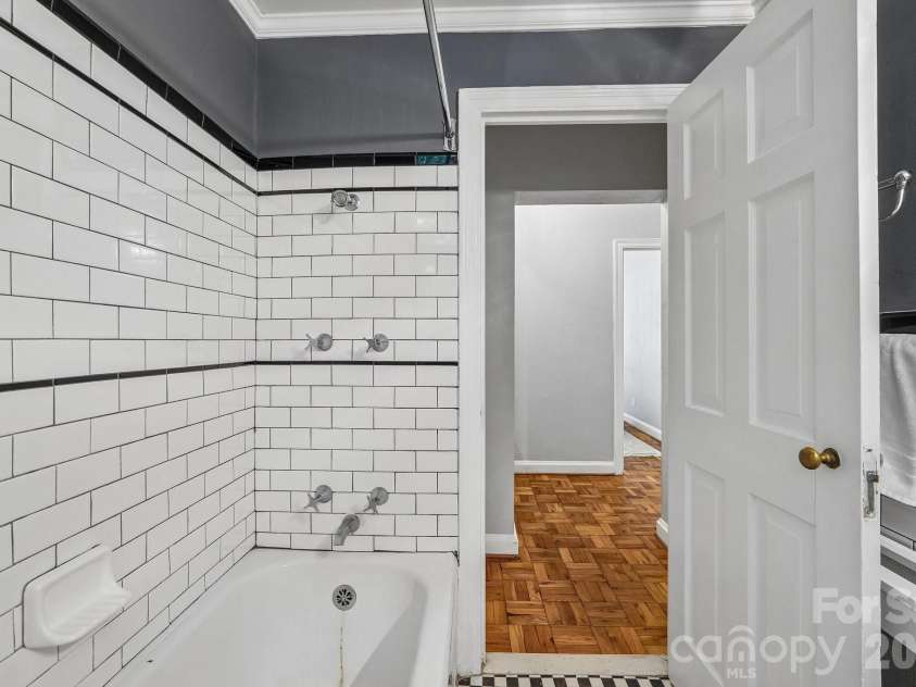 1121 Myrtle Avenue, Charlotte, NC 28203.  MLS# CAR4421930, YatesRealty ID 19454. Updated tub / shower surround