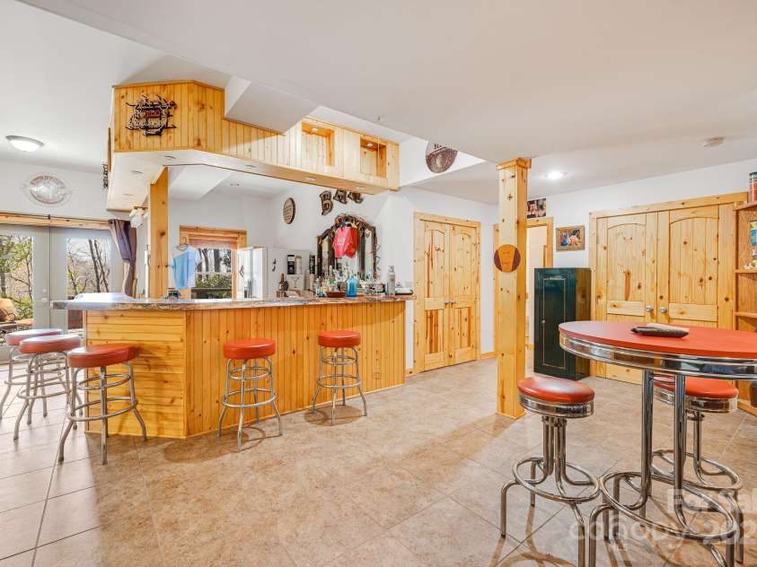 650 Faircrest Lane, Penrose, NC 28766.  MLS# CAR4242109, YatesRealty ID 19454. Lower level Bar