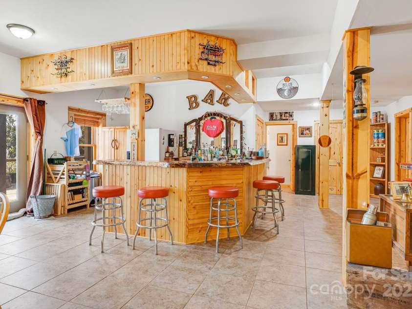 650 Faircrest Lane, Penrose, NC 28766.  MLS# CAR4242109, YatesRealty ID 19454. Lower level Bar