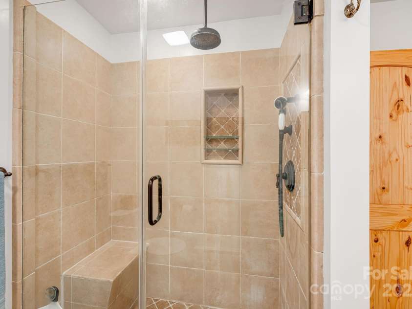 650 Faircrest Lane, Penrose, NC 28766.  MLS# CAR4242109, YatesRealty ID 19454. Lower level shower