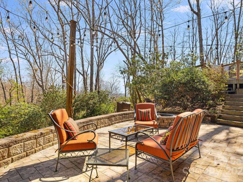 650 Faircrest Lane, Penrose, NC 28766.  MLS# CAR4242109, YatesRealty ID 19454. Patio with fire pit