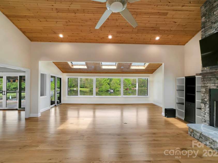 61 Tsataga Court, Brevard, NC 28712.  MLS# CAR4250347, YatesRealty ID 19462. Enjoy breathtaking lakefront views from nearly every room in the home offering a daily backdrop of natural beauty and serenity.