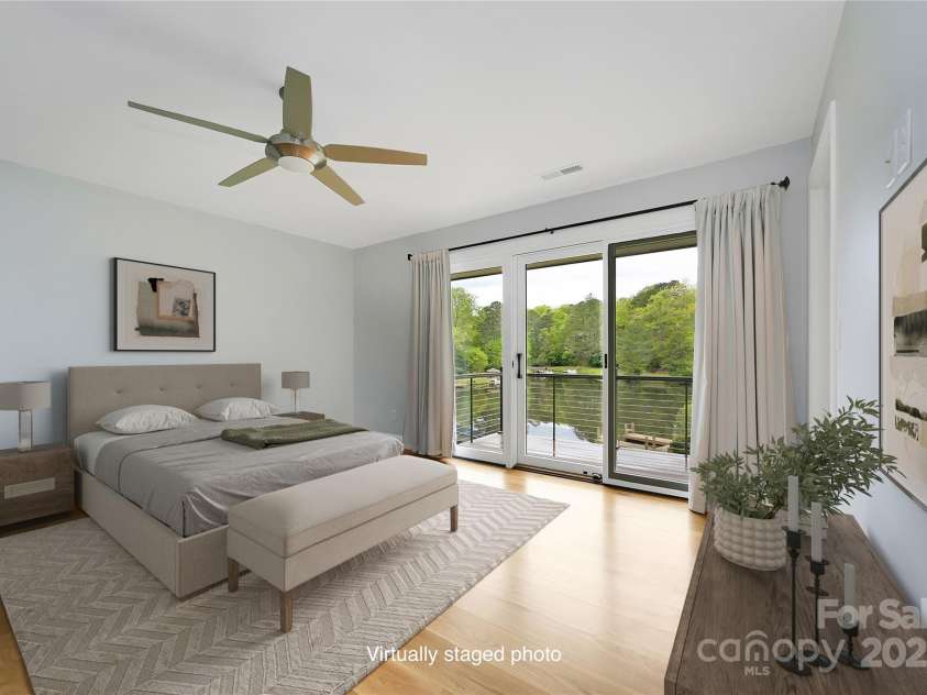 61 Tsataga Court, Brevard, NC 28712.  MLS# CAR4250347, YatesRealty ID 19462. Start every day in your Primary Bedroom with your own breathtaking view of the lake—there's no better way to wake up than with peace, beauty, and nature right outside your window.