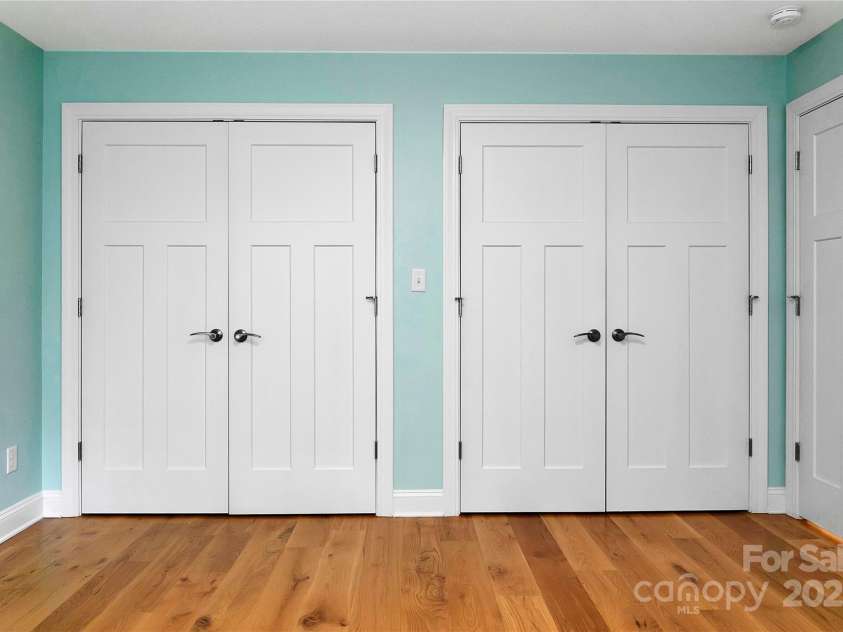 61 Tsataga Court, Brevard, NC 28712.  MLS# CAR4250347, YatesRealty ID 19462. The guest bedroom features double closets, offering generous storage