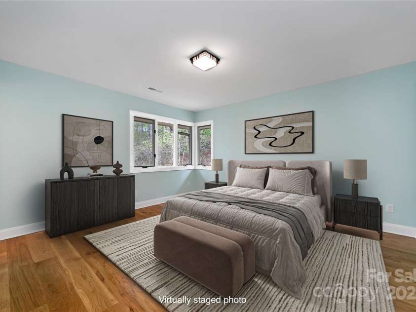 61 Tsataga Court, Brevard, NC 28712.  MLS# CAR4250347, YatesRealty ID 19462. The main floor guest suite offers generous space and plenty of privacy perfect for making visitors feel right at home in their own comfortable retreat.