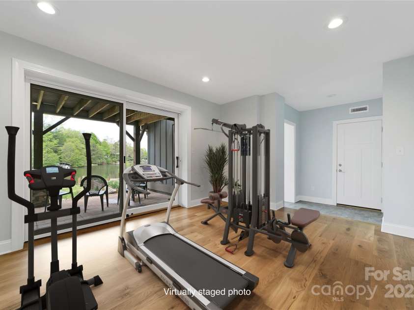 61 Tsataga Court, Brevard, NC 28712.  MLS# CAR4250347, YatesRealty ID 19462. Transform this space into your personal workout zone stay motivated and energized while taking in the inspiring, serene views of the beautiful lake.