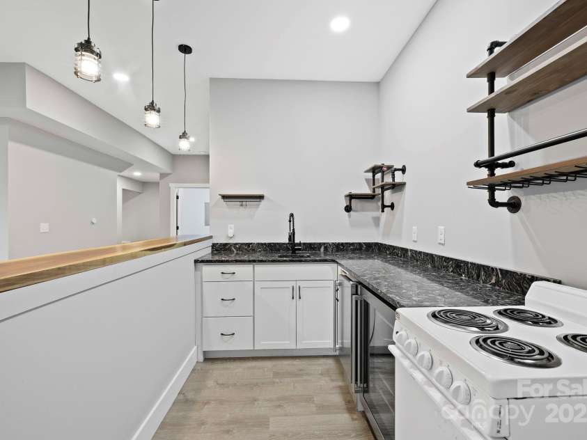 505 Sky Ridge Drive, Leicester, NC 28748.  MLS# CAR4258351, YatesRealty ID 19465. Mini kitchen downstairs