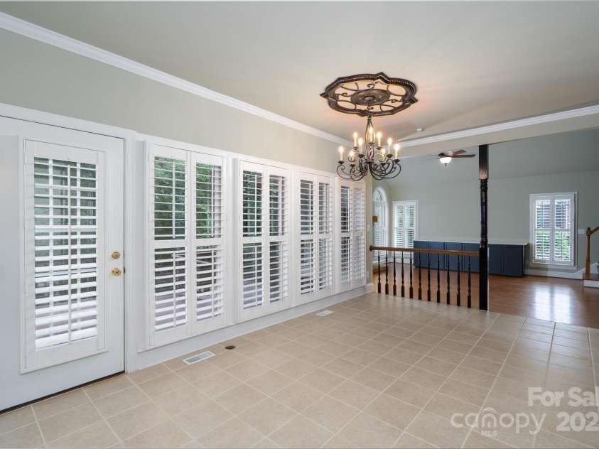 4672 Snow Drive, Harrisburg, NC 28075.  MLS# CAR4268077, YatesRealty ID 19470. Large kitchen/ living area with outdoor access to massive back deck.