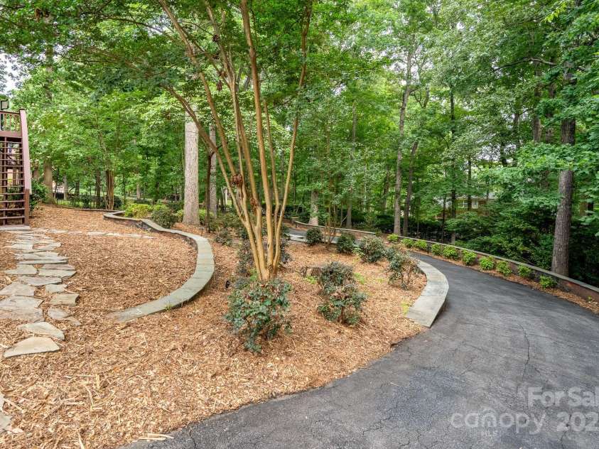 4672 Snow Drive, Harrisburg, NC 28075.  MLS# CAR4268077, YatesRealty ID 19470. Magnificent mature trees all around.