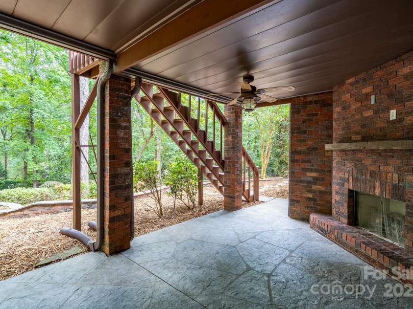 4672 Snow Drive, Harrisburg, NC 28075.  MLS# CAR4268077, YatesRealty ID 19470. Outside fireplace perfect for private nights.
