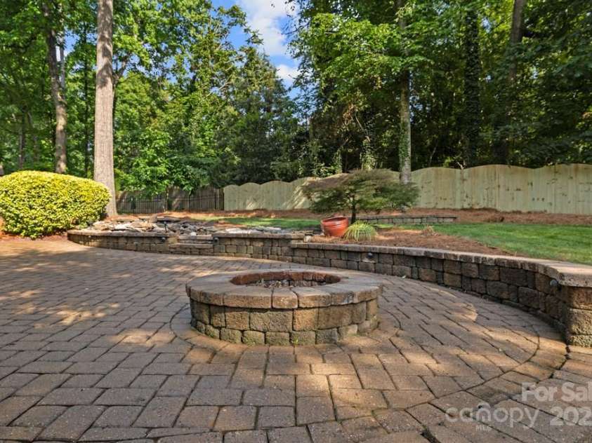 9219 Whispering Wind Drive, Charlotte, NC 28277.  MLS# CAR4261114, YatesRealty ID 19480. Fire pit area ready to make smores!