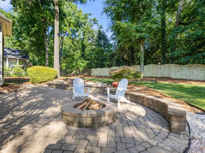 9219 Whispering Wind Drive, Charlotte, NC 28277.  MLS# CAR4261114, YatesRealty ID 19480. Paver patio with fire pit!