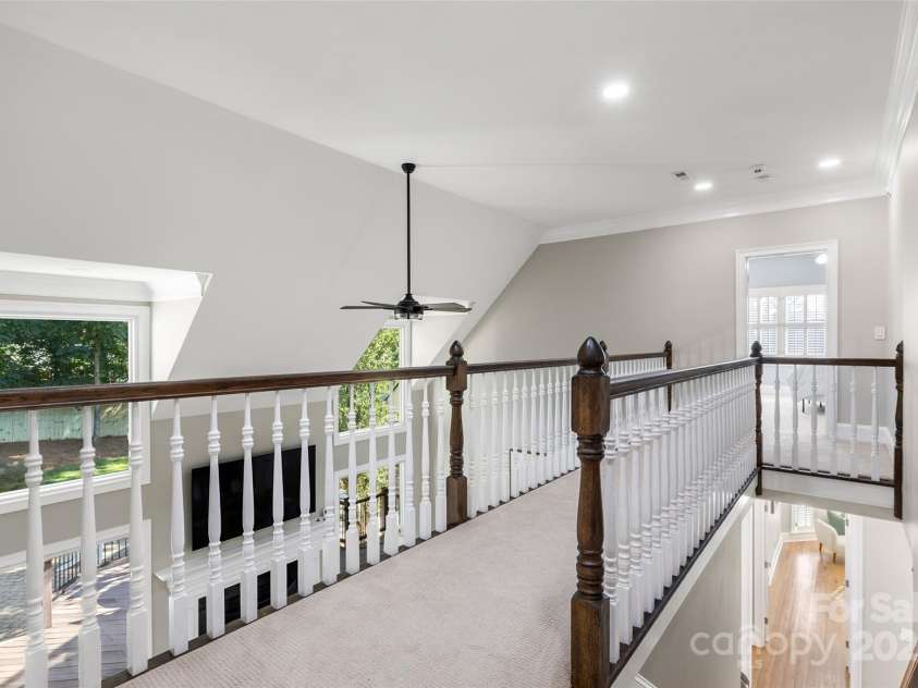 9219 Whispering Wind Drive, Charlotte, NC 28277.  MLS# CAR4261114, YatesRealty ID 19480. Upstairs catwalk is so open and airy!