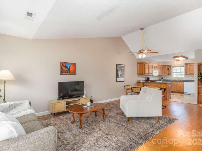 104 Kerlee Street, Black Mountain, NC 28711.  MLS# CAR4245652, YatesRealty ID 19482. Great Room toward Dining & Kitchen