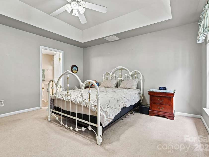 6859 Lakecrest Court, Denver, NC 28037.  MLS# CAR4290667, YatesRealty ID 19483. Large Primary bedroom with tray ceiling
